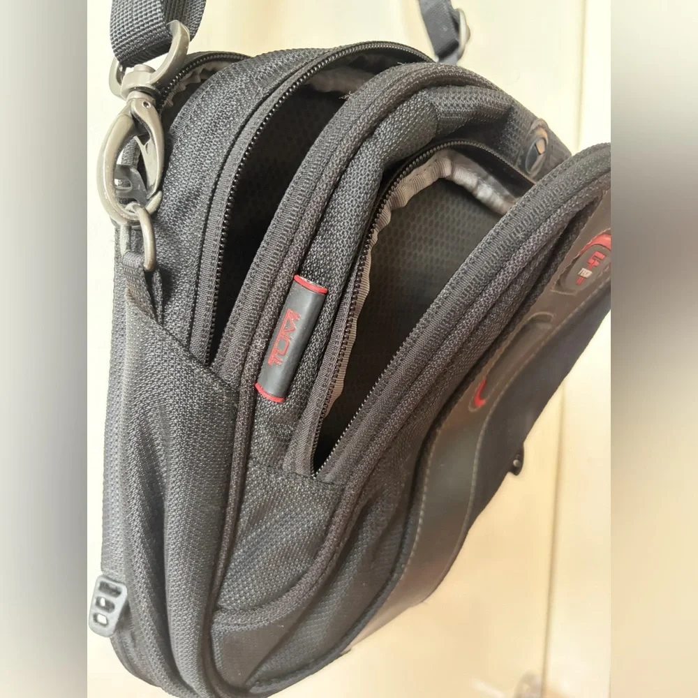 Tumi T-Tech sling bag with multiple compartments and Keychain mens